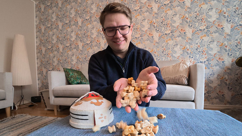 A man playing with Mongolian animal bones.