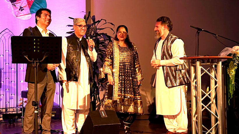 Happy people smiling and speaking to audience,