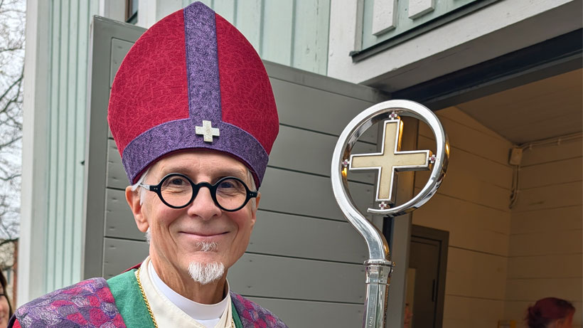 A bishop smiling.
